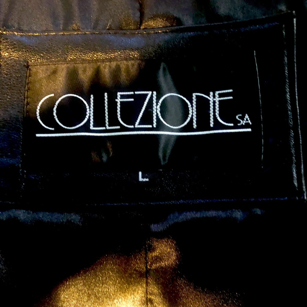 Black leather coat with pockets in a size large.  The length above the knees.